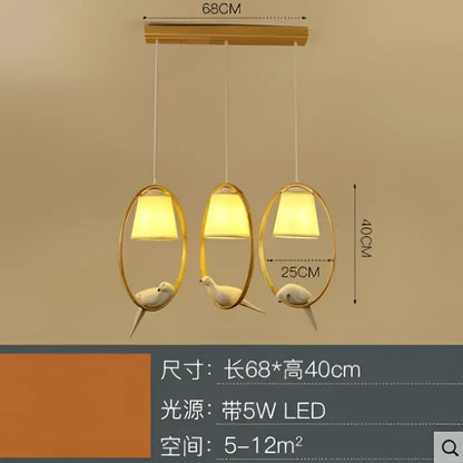 Modern wood bird glass pendant light with gold-toned oval lampshades and white bird figurines decorbites bird glass pendant
