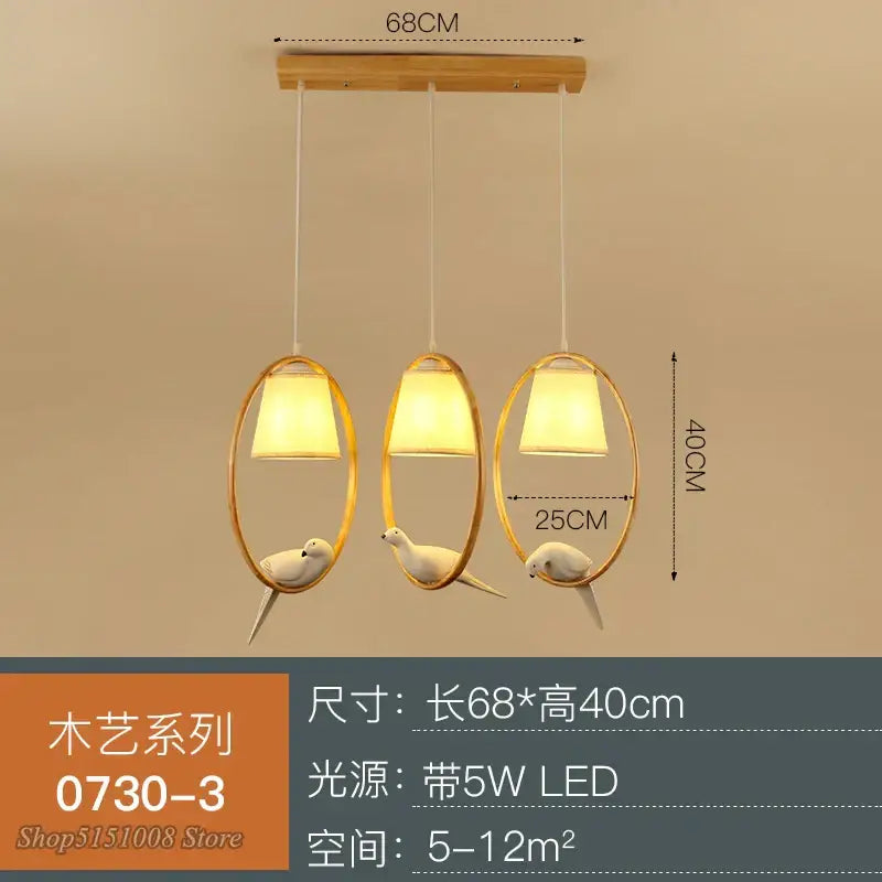 Modern wood bird glass pendant light with gold oval frames, white ceramic birds, and warm led lighting for kitchen decorbites bird glass pendant