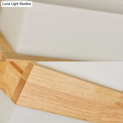 Lightweight wooden shelf with smooth natural finish and clean edges complements modern wood deco milk glass wall lamp
