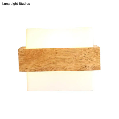 Minimalist modern wall lamp with warm wood deco milk frame and two off-white deco milk glass panels for bedroom use