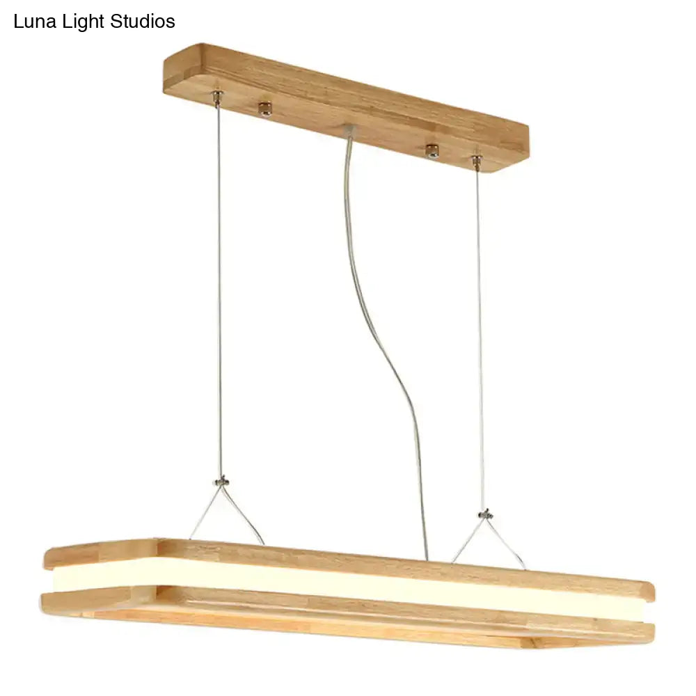 Modern wood rectangular hanging island lamp with natural wood frame and illuminated LED strip for dining room