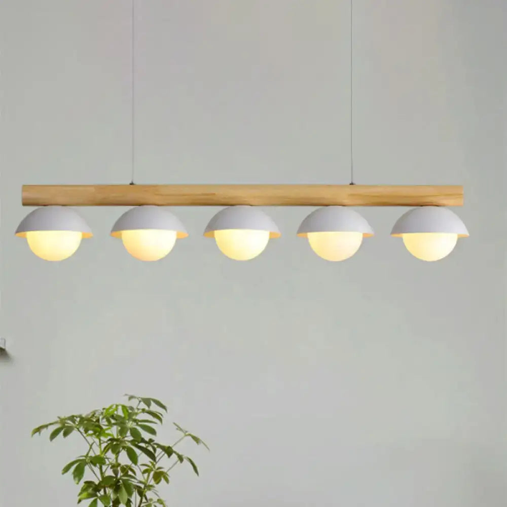 DecorBites modern wood stem linear chandelier with five white shade pendant lights emitting warm illumination