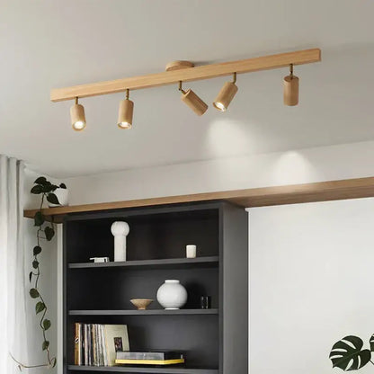 Modern wood three light adjustable gu10 led ceiling lamp with light wood finish and four cylindrical spotlights by decorbites