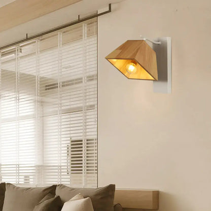 Modern wood trapezoid wall sconce with direct wired white metal bracket and illuminated light wood fixture height design
