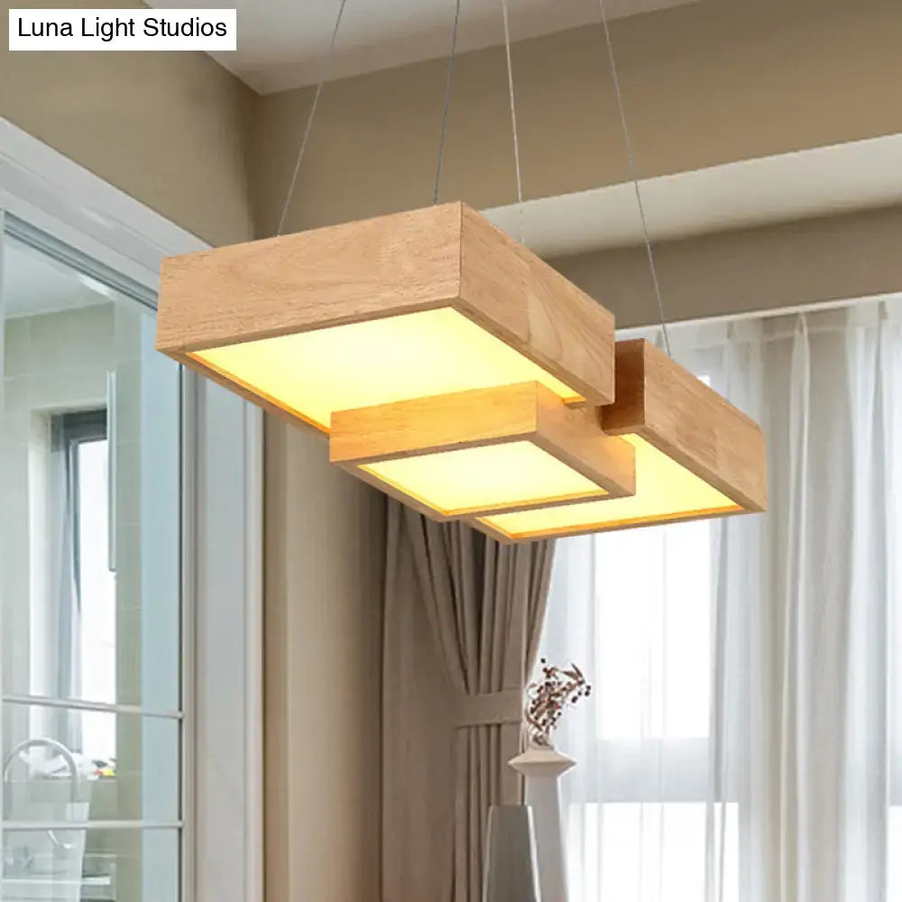 Modern wooden square led ceiling light fixture with warm yellow glow and layered geometric design for kitchen island