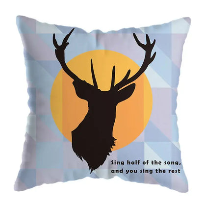 Square throw pillow with a geometric deer print featuring a black deer silhouette and yellow, blue, and white patterns