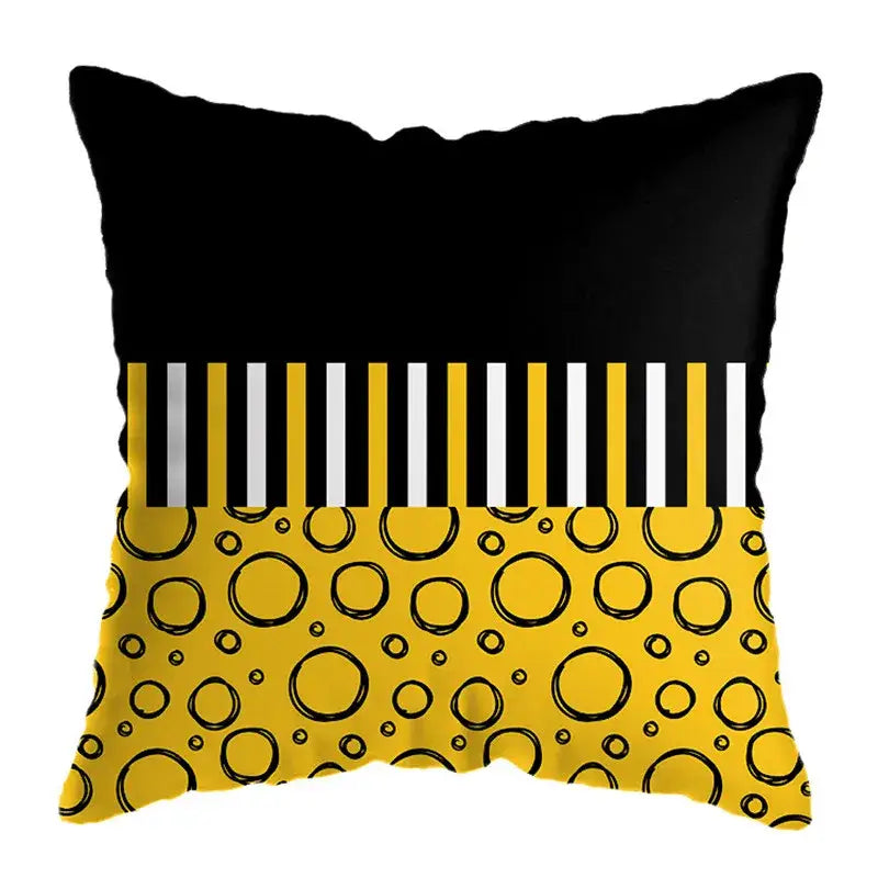 Modern yellow and black geometric deer print throw pillow with bold stripes and hand-drawn circles for living room decor