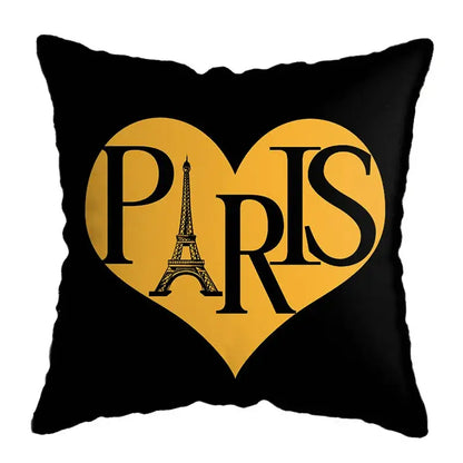 Black throw pillow with a yellow heart featuring paris and eiffel tower outline for modern geometric deer print decor