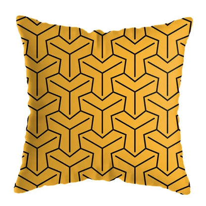 Modern yellow and black geometric deer print throw pillow with bold 3d-like interconnected lines on vibrant fabric