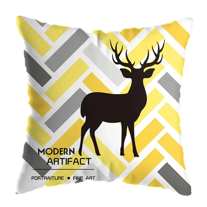 A square throw pillow with a black deer print on yellow gray and white geometric chevron patterns for living room