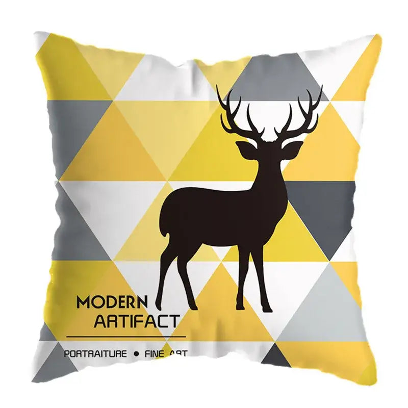 A square throw pillow with a black deer print on a yellow gray and white geometric deer pattern for living room