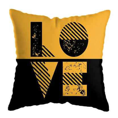 Modern yellow and black throw pillow with bold love design and geometric deer print for living room decor
