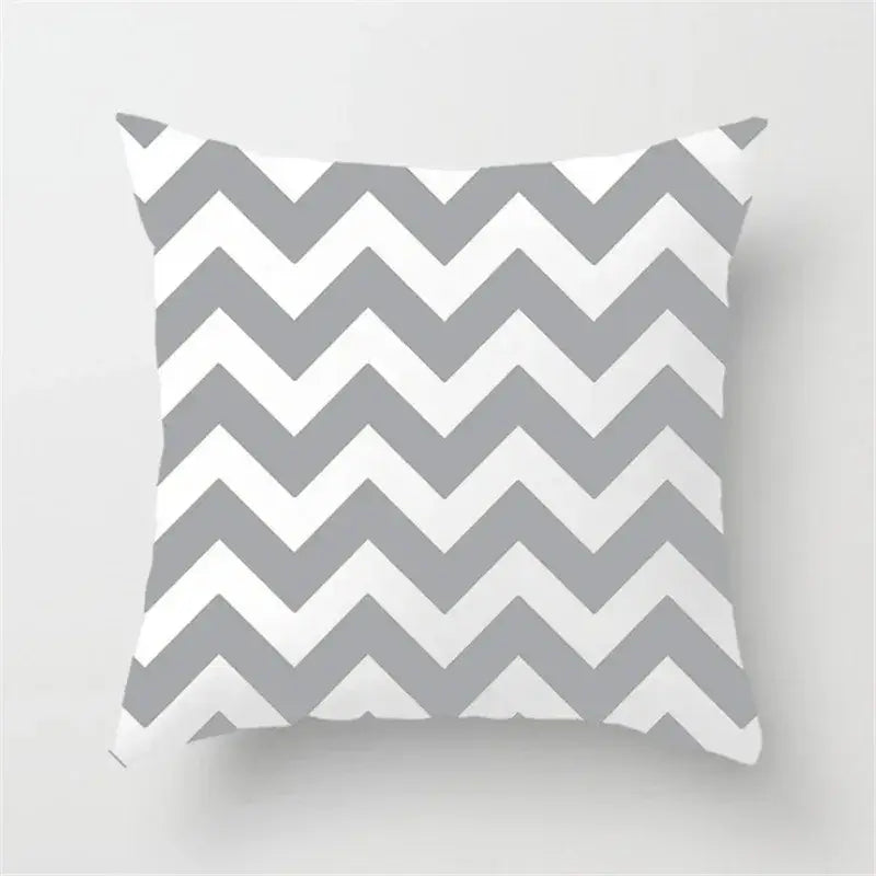 A square throw pillow with a bold gray and white chevron pattern ideal for decorbites geometric stripe decor