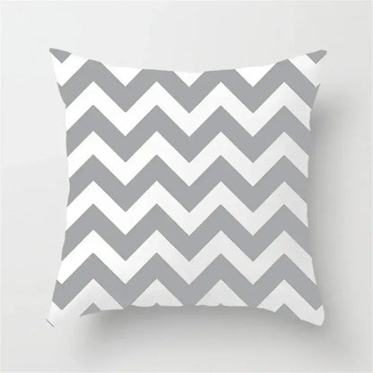 A square throw pillow with a bold gray and white chevron pattern ideal for decorbites geometric stripe decor