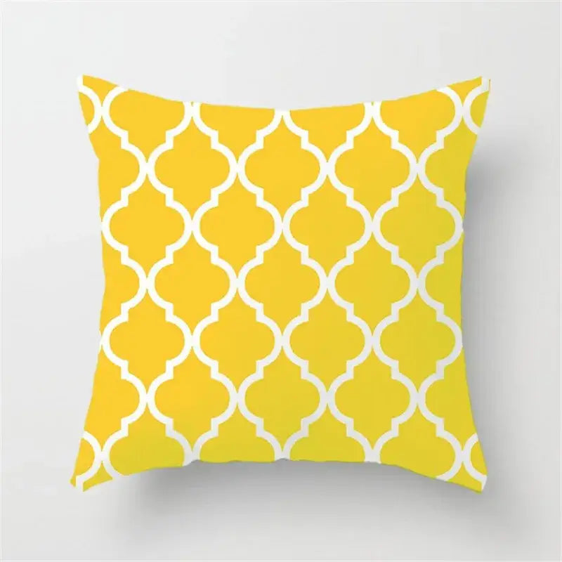 Modern yellow and gray geometric stripe pillowcase with bright yellow throw pillow featuring white quatrefoil decorbites geometric stripe design