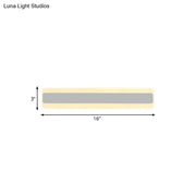 Modern yellow and gray led white light strip bathroom vanity fixture with pale yellow casing and central gray illuminated band