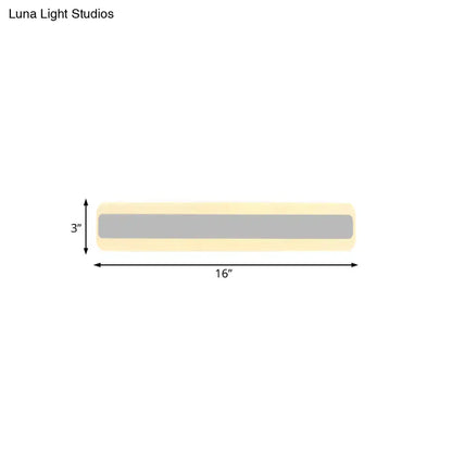 Modern yellow and gray led white light strip bathroom vanity fixture with pale yellow casing and central gray illuminated band