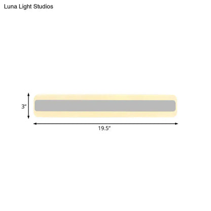 Modern yellow and gray led white light strip bathroom vanity fixture with sleek rectangular design and soft yellow casing