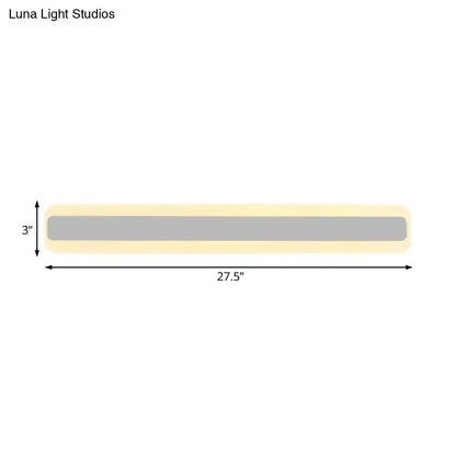 Modern yellow and gray bathroom vanity led light strip with white light features a sleek gray panel and cream casing