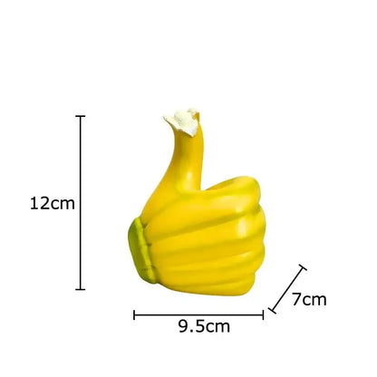 Modern yellow banana fist resin statue desk ornament with bright yellow thumbs-up and white popcorn textured top