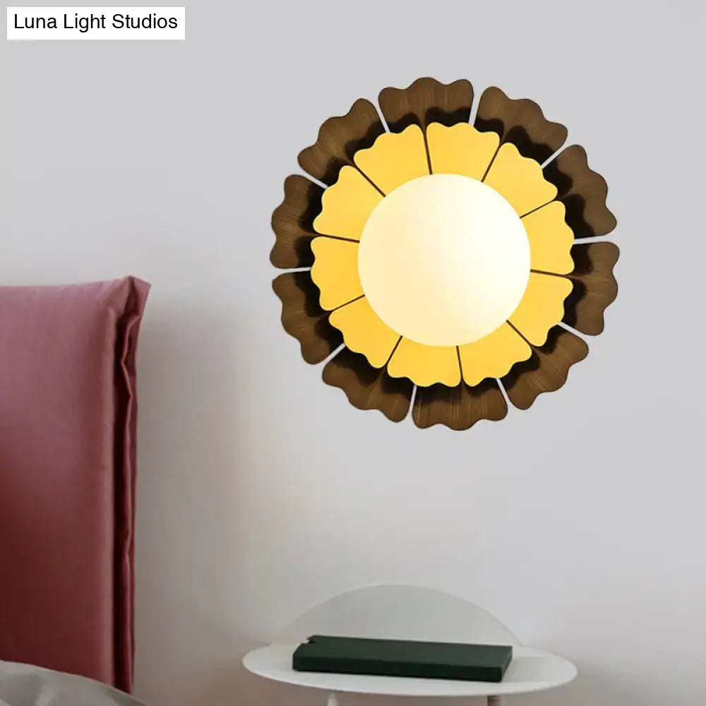 Modern yellow and brown sunflower wall sconce with layered petal glass design for bedroom lighting