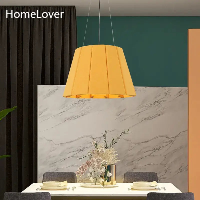 Modern yellow pleated fabric felt pendant light designed as a dining room pendant light with echo felt material