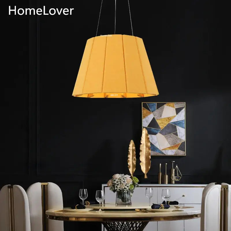 Modern yellow pleated fabric felt pendant light with tapered design ideal for dining room as a felt pendant light
