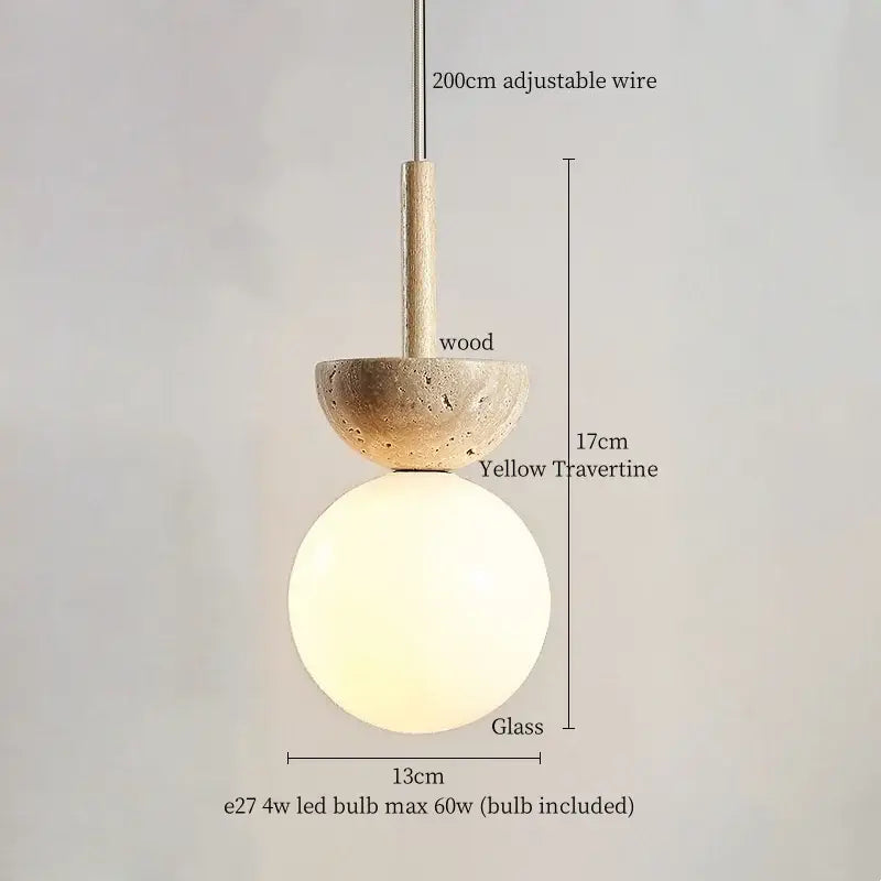 Modern yellow travertine led pendant lights with a warm frosted glass globe and wooden accent for kitchen island decorbites