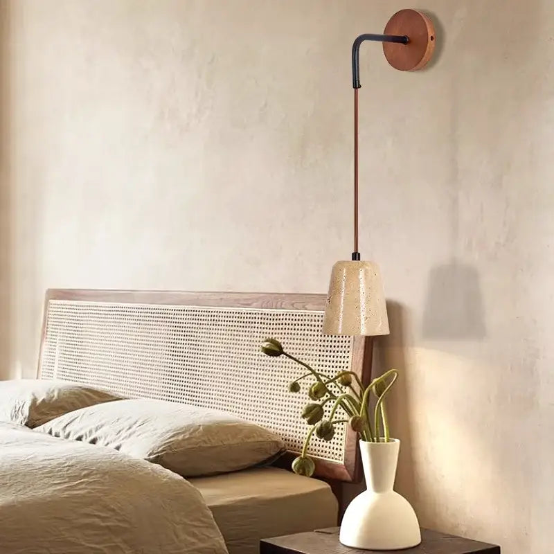 Copper-toned wall lamp with black arm and off-white ceramic shade for modern yellow travertine decorbites led yellow lighting