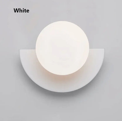 White minimalist kids macaron led wall lamp with circular diffused light and sleek semi-circular base decorbites kids macaron