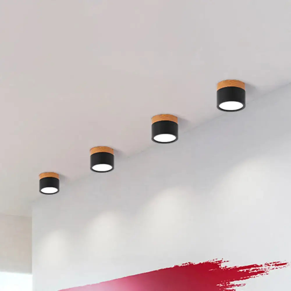 Modern black and wood flush mount ceiling light with circular design by decorbites for kitchen bar use