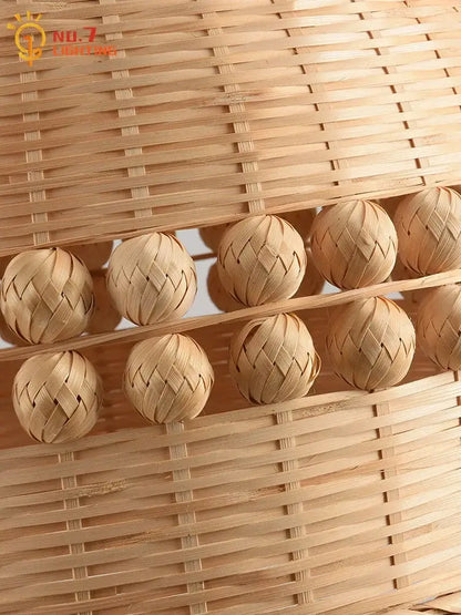 Handwoven natural bamboo massage balls in a matching woven basket complement a modern zen bamboo weave pendant light