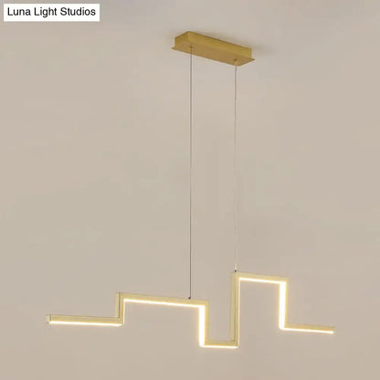 Modern zigzag linear metal hanging light fixture with gold finish and illuminated rectangular bars for dining room use