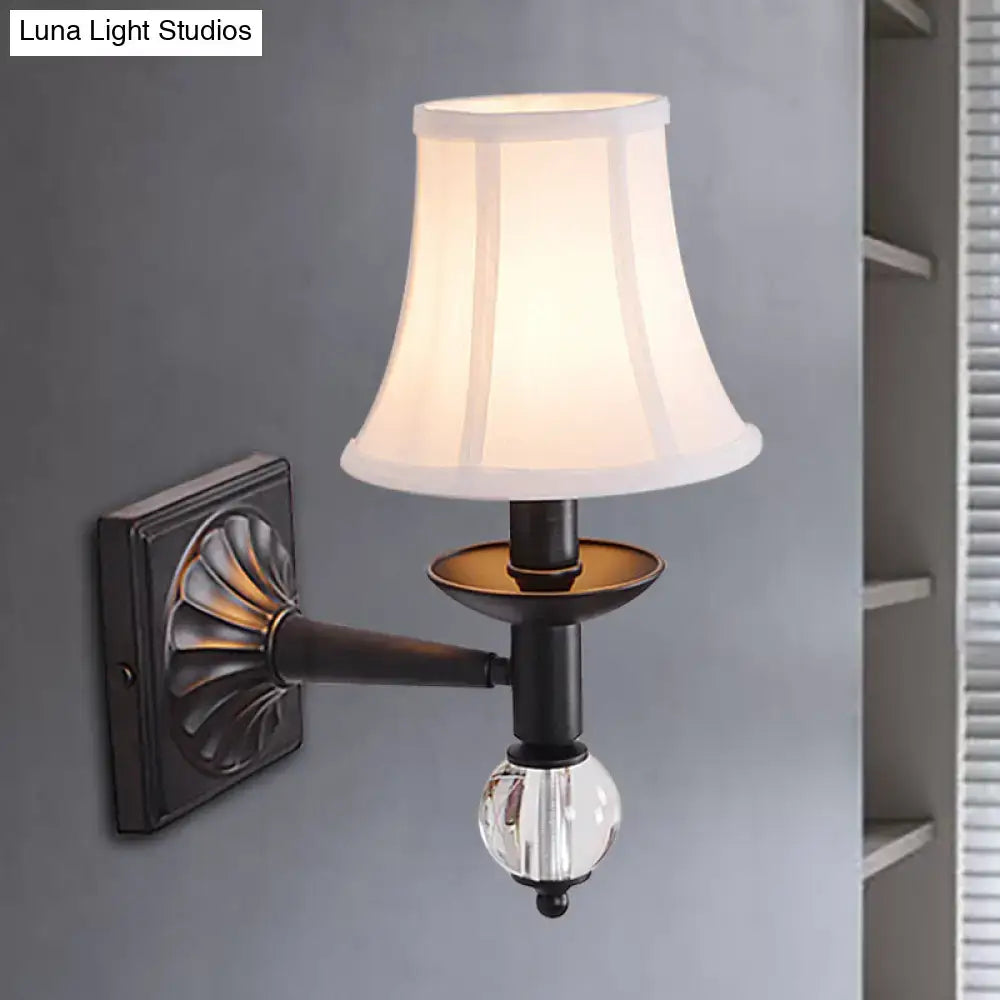 Antique bronze-finished modernist bell wall sconce with white pleated lampshade and clear crystal globe accent