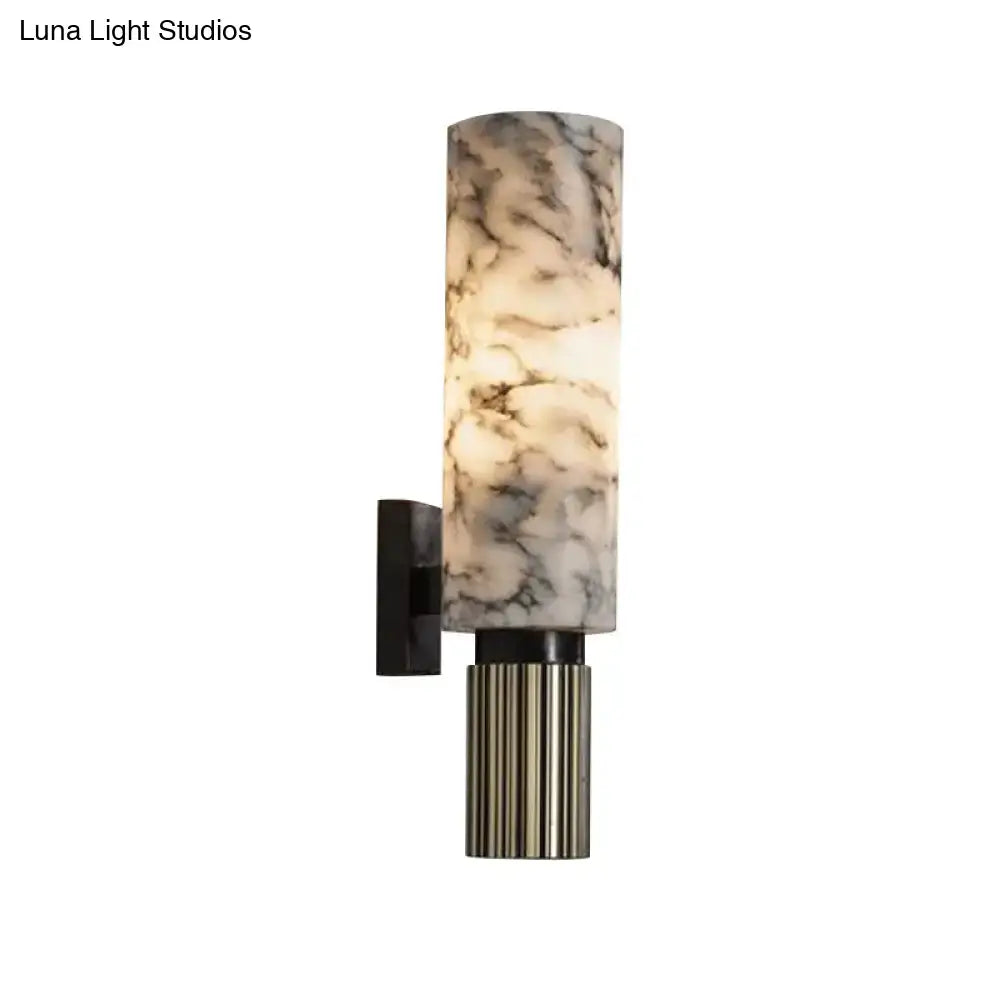 Elegant modernist black and marble coffee house wall sconce with cylindrical translucent shade and fluted metallic base