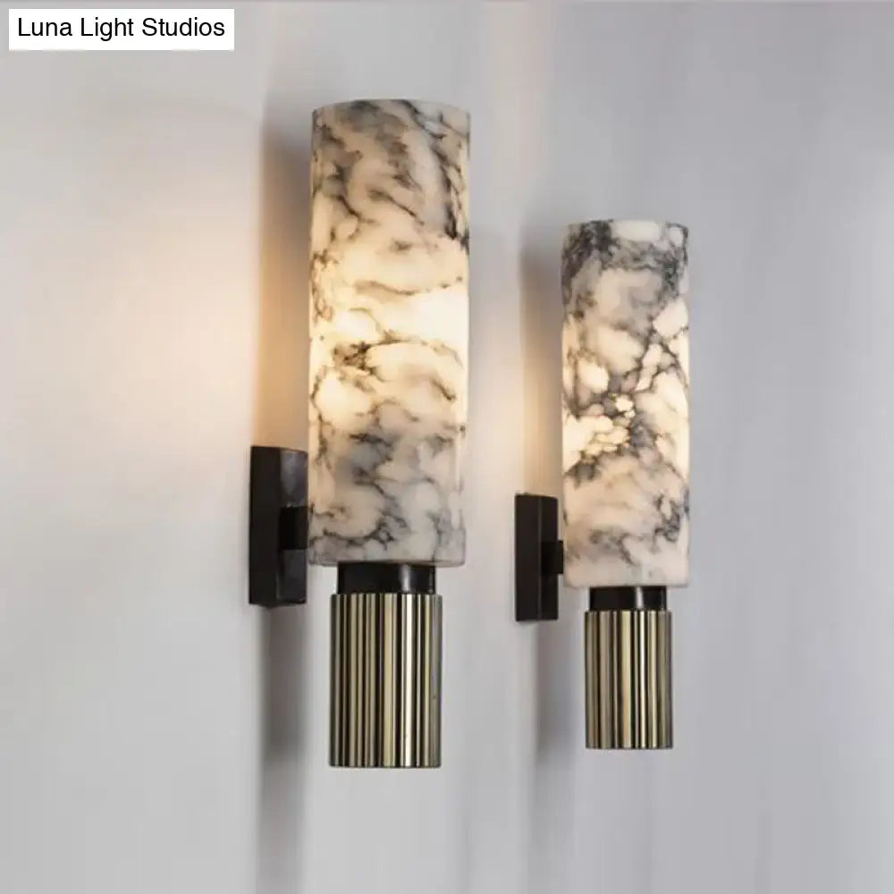 Modernist black and marble coffee house wall sconce with elegant marble pattern and fluted brass base for living room light