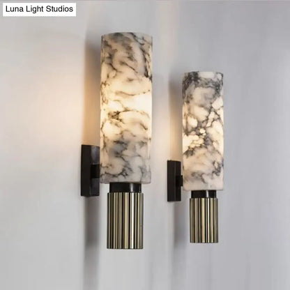 Modernist black and marble coffee house wall sconce with elegant marble pattern and fluted brass base for living room light