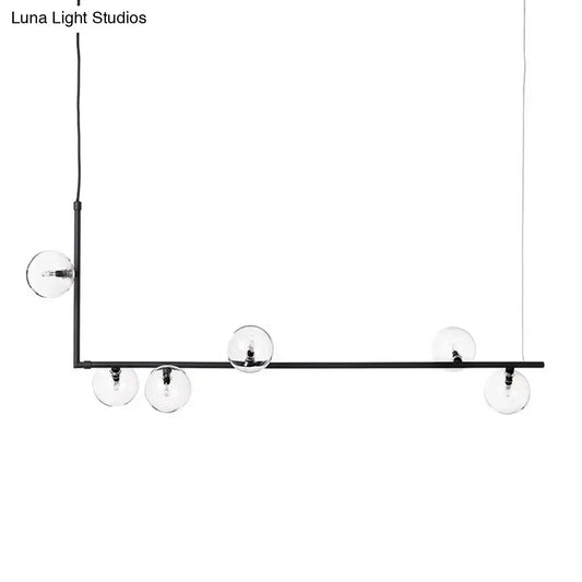 DecorBites modernist black metal chandelier with five clear glass globe bulbs and right angled frame in warm white lighting