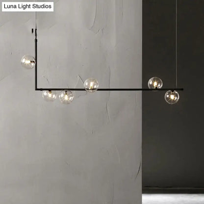 Modern black metal pendant light with five clear glass globe bulbs for stylish interior lighting
