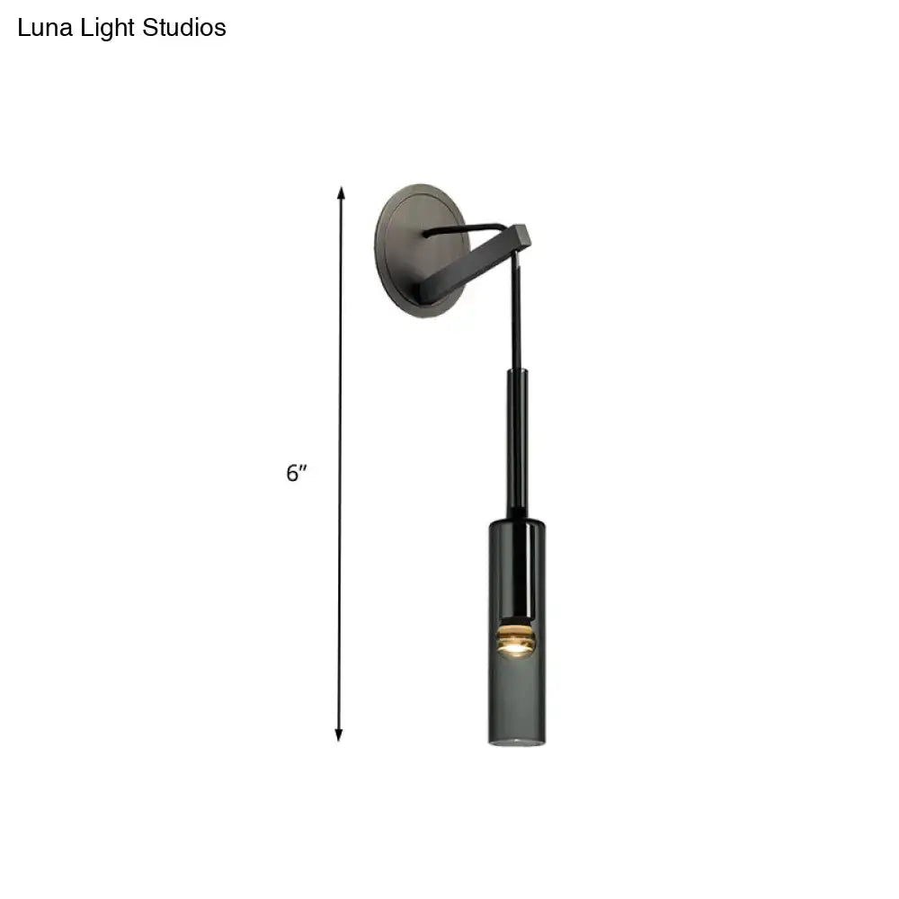Modernist black led crystal tube wall sconce with adjustable arm and cylindrical glass shade featuring black matte finish