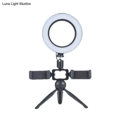 Black tripod-mounted led ring light with mobile phone support and adjustable stand for bedroom wall light use