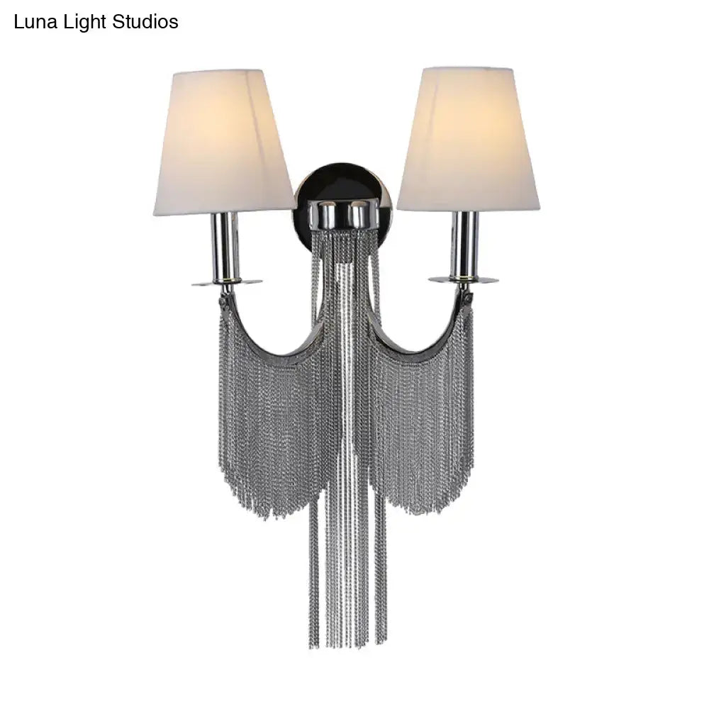 Modernist black and silver tassel wall sconce with chrome finish cream fabric shades and e12 light for bedroom use