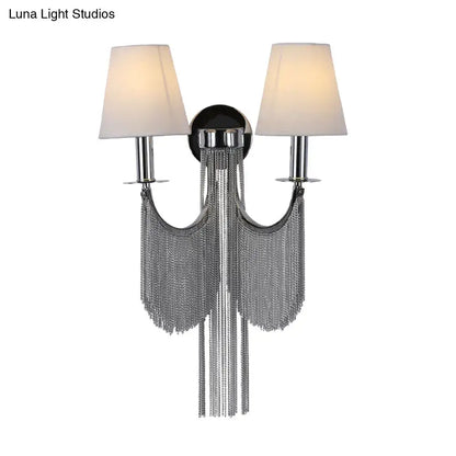 Modernist black and silver tassel wall sconce with chrome finish cream fabric shades and e12 light for bedroom use
