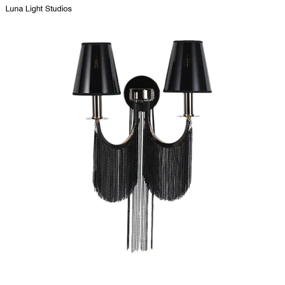 Modernist black and silver tassel wall sconce with e12 light, fringed design, chrome accents, and conical shades for bedroom