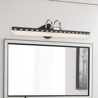 Modern black and chrome led vanity light with curved arm and diamond cutouts for natural light in black white bathroom