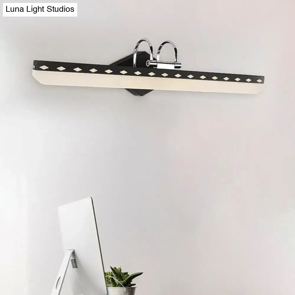 Modernist black and white led vanity light with curved arm and chrome diamond accents providing natural light