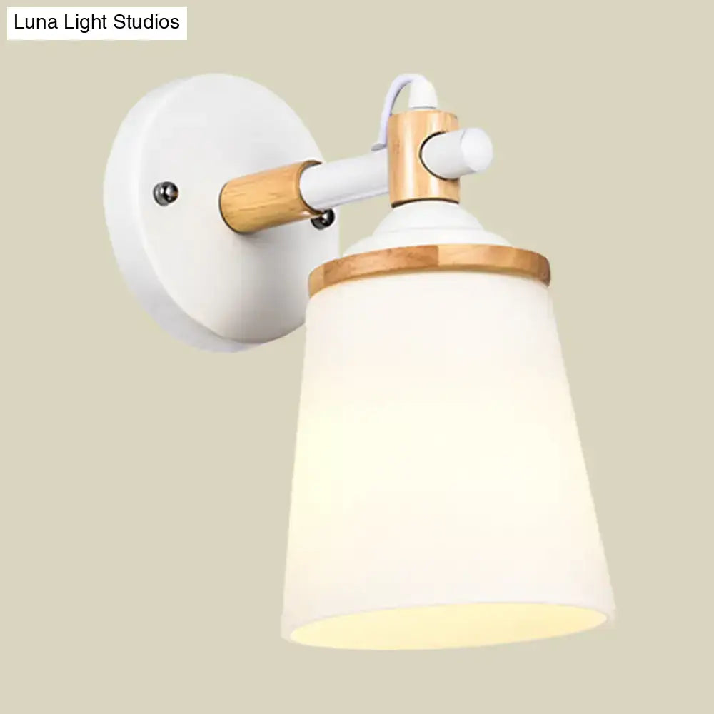 Modernist wall lamp with white black bamboo finish and cream glass shade for bedroom lighting