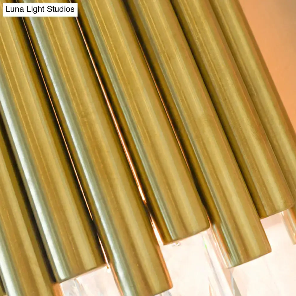 Modernist wall light with golden brass chimes and clear faceted crystal accents for living room illumination