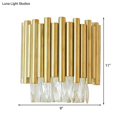 Modernist brass wall light with gold-toned rods and clear faceted crystal accents for living room lighting
