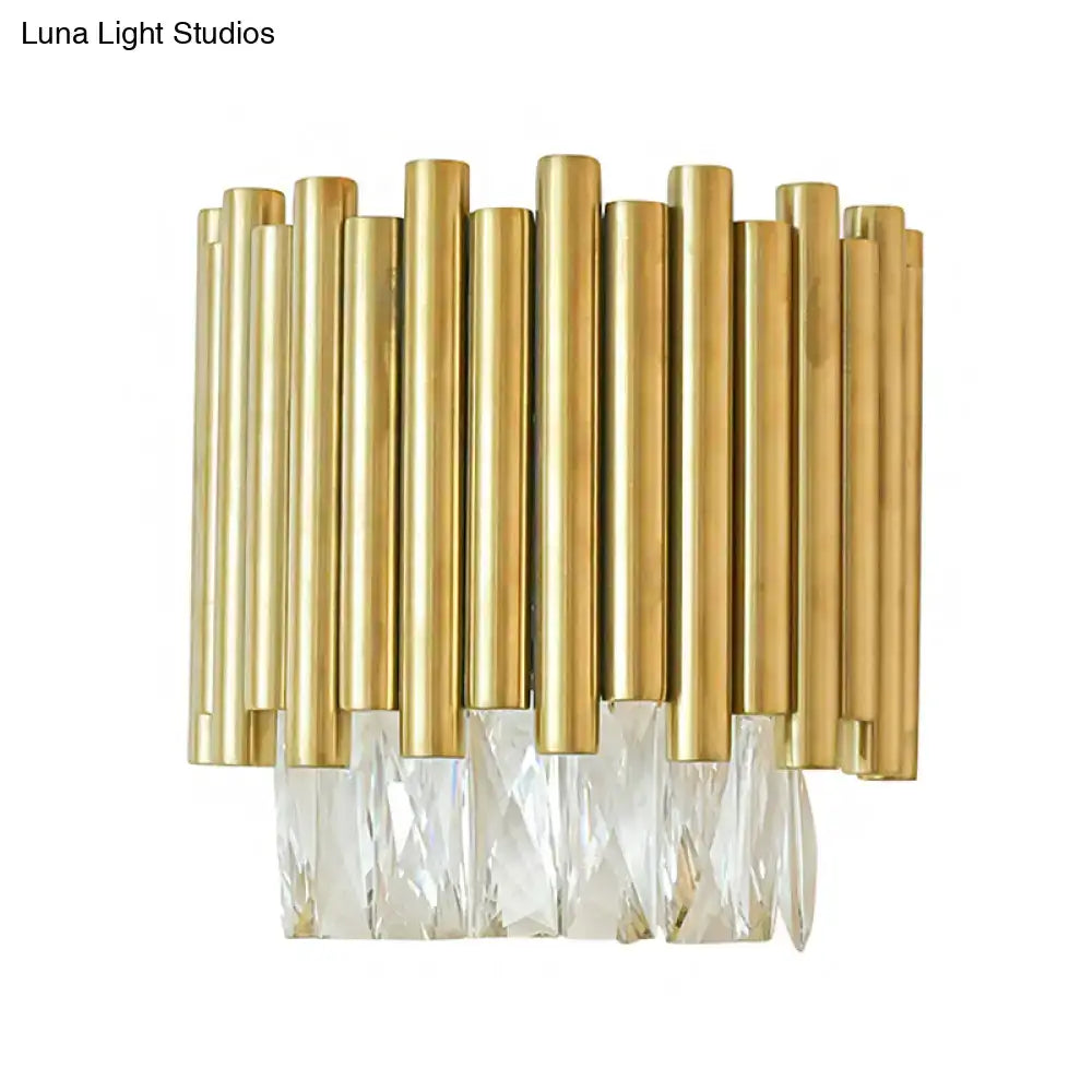 Modernist wall light with gold-toned brass rods and clear faceted crystal prisms for living room decor